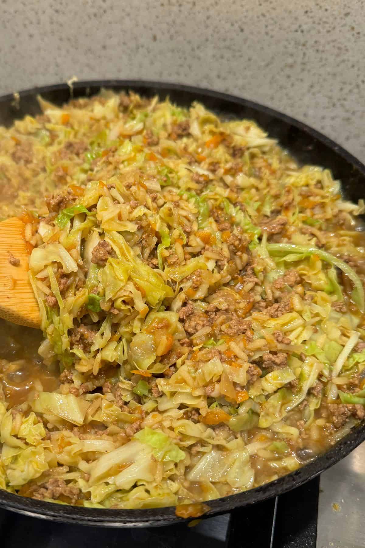 Cabbage Mince Chow Mein cooking in frypan.