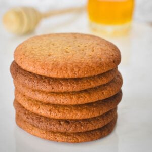 Honey Snaps Biscuits stacked on plate.
