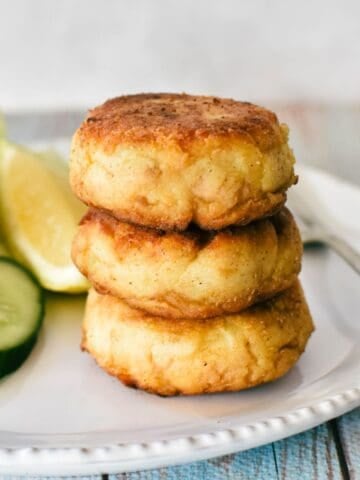 Tuna Patties piled on plate.