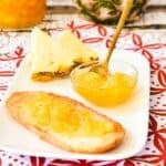 Pineapple Jam on toast and in jar in background.