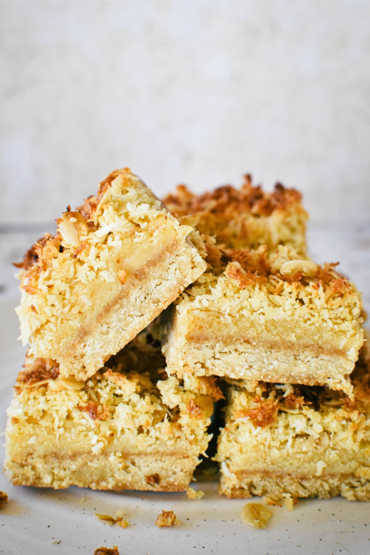 Caramel Oat Slice stacked on plate.
