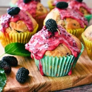 Mulberry Muffins on wooden board.