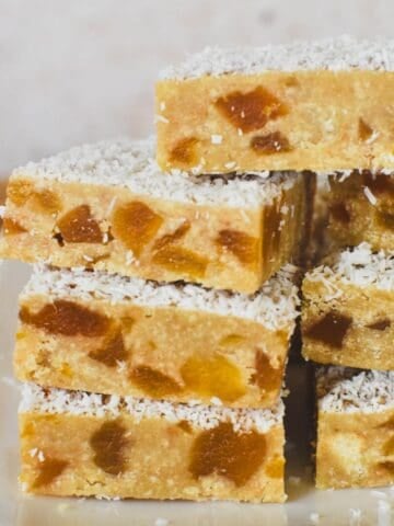 Apricot Slice stacked on a plate.