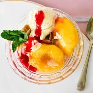Peach Melba in glass bowl.