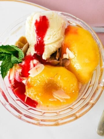 Peach Melba in glass bowl.