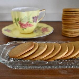 Ginger Biscuits on old fashioned glass serving plate.