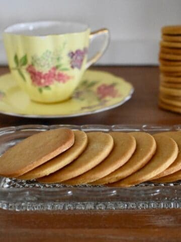 Ginger Biscuits on old fashioned glass serving plate.