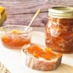 Pumpkin Jam on toast with jar in background.
