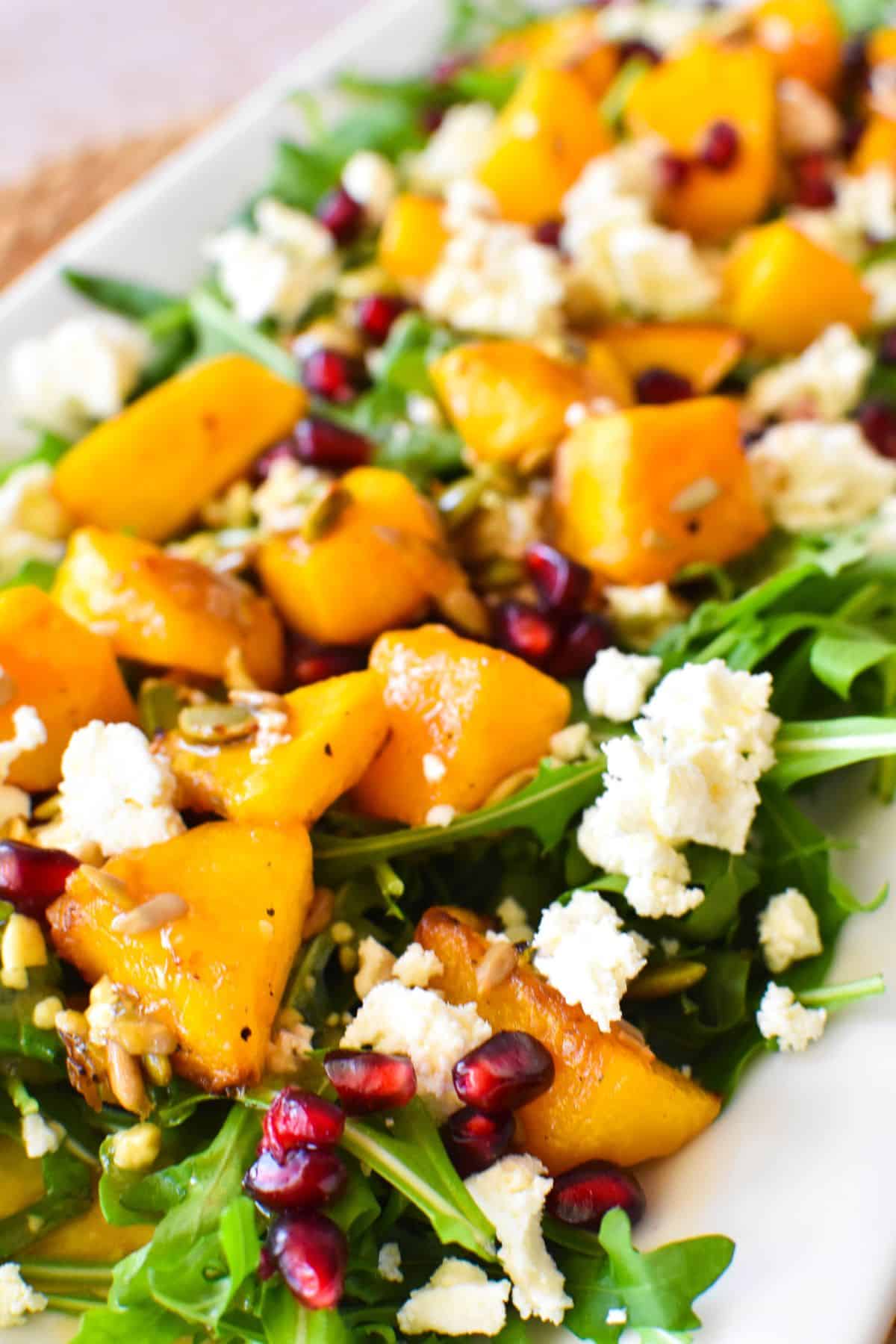 Pumpkin Salad with roasted pumpkin, rocket, feta, pomegranate and seeds.