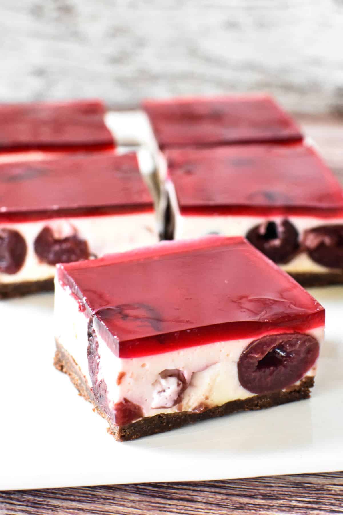 Black Forest Cheesecake slice on serving plate.